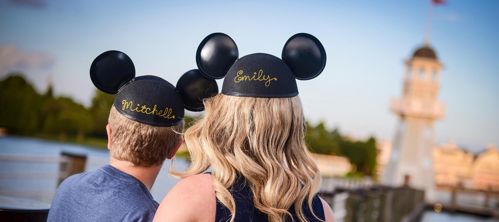 Picture of two kids from behind wearing Mickey Mouse Ears